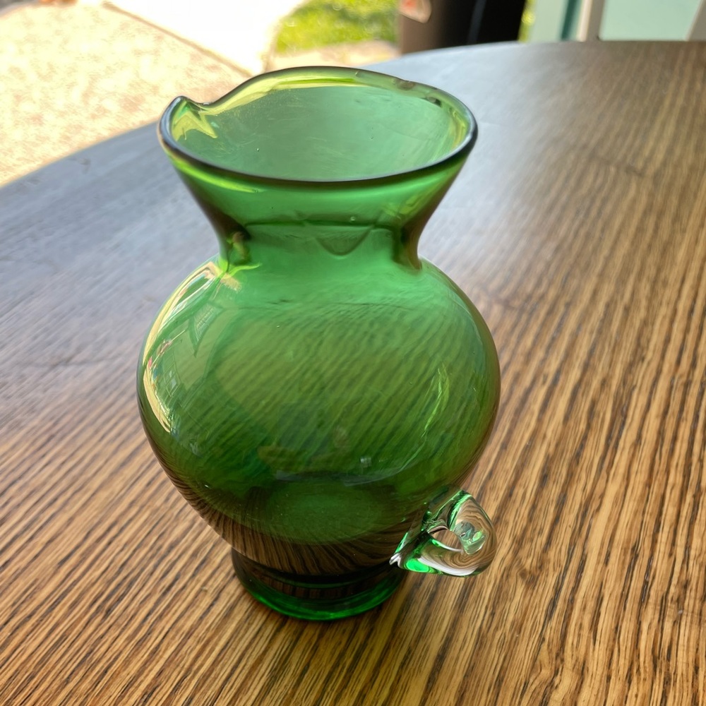 Small green glass pitcher applied clear finger loop handle